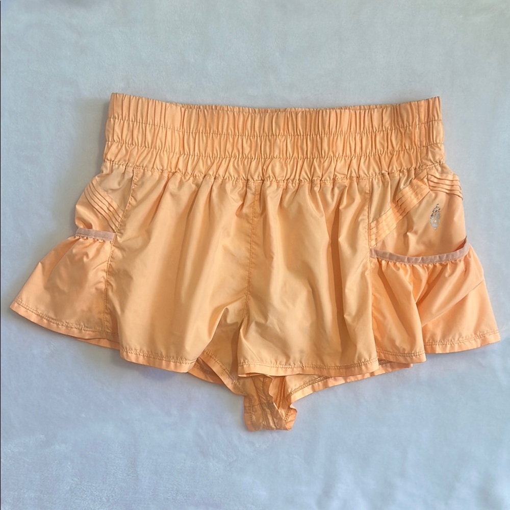 Free People Movement Get Your Flirt On Shorts in color Pastel Peach | M